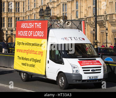 Westminster, London, UK. 7th Mar, 2017. A mobile billboard van from the English Trades Union Congress (ECTU) drives past the Palace of Westminster, calling for the abolition of the House of Lords. Credit: Paul Davey/Alamy Live News Stock Photo