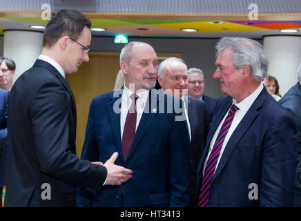 March 6, 2017 - Brussels, Belgium: Hungarian Minister of Foreign Affairs & External Economy Peter Szijjarto (L) is talking with the Polish Minister of National Defense Antoni Macierewicz (C) and the Luxembourg Minister of Foreign Affairs & Immigration Jean Asselborn (R) during an EU Defense and foreign affairs Ministers meeting in the Europa building, the EU Council headquarter. - NO WIRE SERVICE- Photo: Thierry Monasse/dpa Photo: Thierry Monasse/dpa Stock Photo