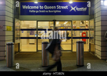 Queen Street station Glasgow tourists waiting for trains night Stock Photo