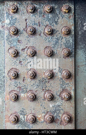 Bolted steel girder, nuts, rusty metal surface, structures, Stock Photo