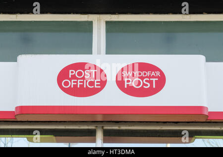 Sign above the Post Office in Abergavenny in English and Welsh Stock Photo