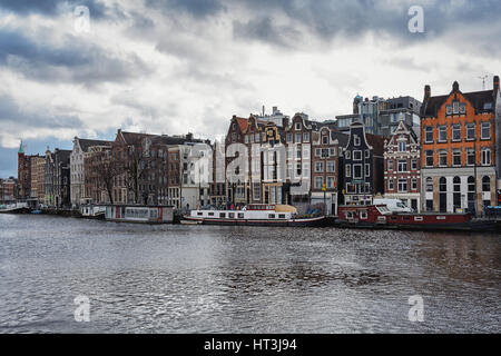 Amsterdam, Netherlands – February 7, 2016: a look at the canal houses along the Amstel River in Amsterdam city center. Stock Photo