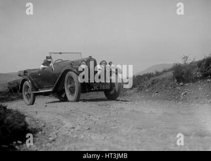 Kitty Brunell road testing a Riley 9 WD tourer, c1930 