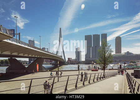 Rotterdam, Netherlands – August 18, 2016: Picture of the Erasmus bridge and for the building the Rotterdam along the Wilhelminakade has the AIDA cruis Stock Photo