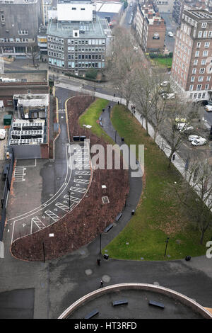 Aerial view to street below of buildings and car park from Level 10 of new Switch House Extension at Tate Modern Art Gallery London  UK  KATHY DEWITT Stock Photo