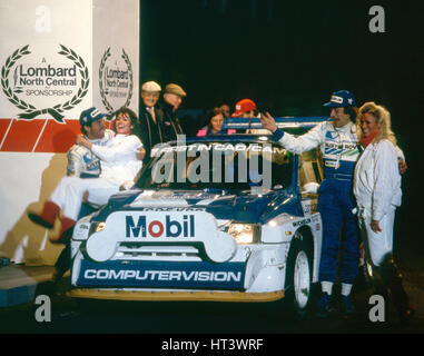 1986 RAC Rally. Tony Pond and Rob Arthur celebrate finishing 6th in MG Metro 6R4 Artist: Unknown. Stock Photo