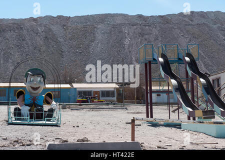 Chuquicamata town, once a thriving company town with banks, restaurants and playgrounds, but which has since been evacuated due to legal and health is Stock Photo