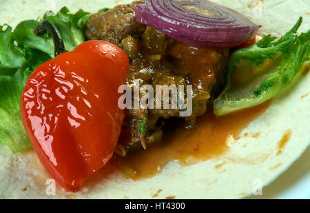 Lamb with hummus and tortillas Stock Photo