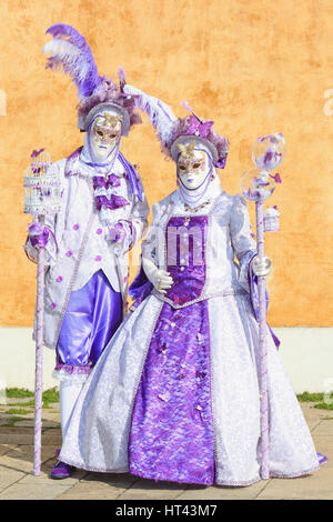 A masked couple in traditional Venetian costumes during the 2017 Carnival of Venice, Italy Stock Photo