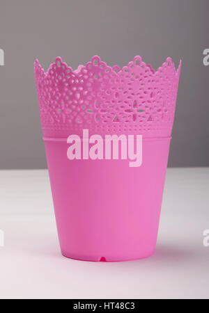 Empty pink plastic flower pot, front view Stock Photo