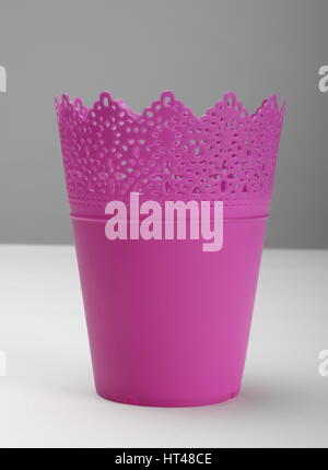 Empty pink plastic flower pot, front view Stock Photo