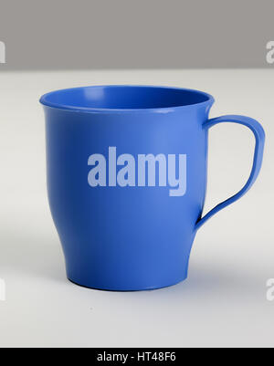 Empty plastic blue cup with handle, front view Stock Photo