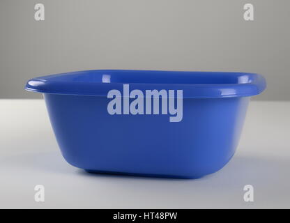 Blue plastic deep bowl, isolated on white background Stock Photo