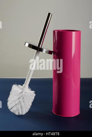 Pink plastic toilet brush with metal handle Stock Photo