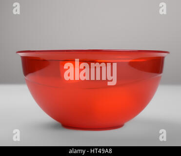 Red transparent plastic deep dish, front view Stock Photo