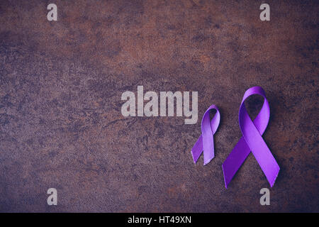 Purple ribbons,toning copy space background, Alzheimer's disease, Pancreatic cancer, Epilepsy awareness, Hodgkin's Lymphoma awareness Stock Photo