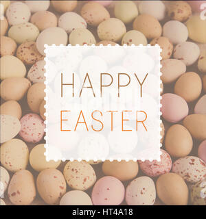 Happy Easter on pastel speckled eggs, toning Stock Photo