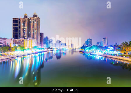 View of Kaohsiung financial district and love river at night Stock Photo