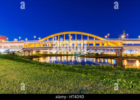 Riverside night view of MacArthur bridge in Taipei Stock Photo