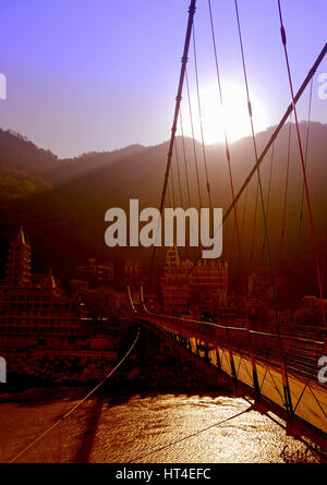 Laxman Jhula bridge over Ganges river Stock Photo