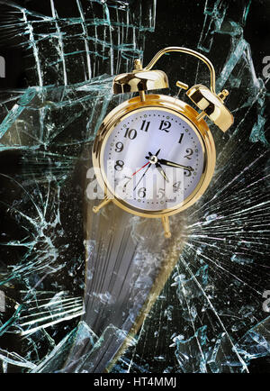 Time flying through broken glass window. Stock Photo