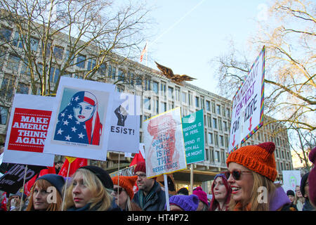LONDON, UK - JANUARY 21: Protestors carry their banner past the American Embassy at  Grosvenor square during the Women's march. About half a million demonstrators participate  in London as part of an international campaign on the first full day of Donald Trump's presidency on January 21, 2017. The London march is one of almost 700  sister marches taking place in over sixty countries, organisers aim to highlight women's rights issues, which they perceive to be under threat from the new US administration. © David Mbiyu/Alamy Live News Stock Photo