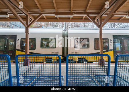 Szklarska Poreba, Poland -  February 2017 :  Ready to depart local train operated by Koleje Dolnoslaskie company standing on a platform on the train s Stock Photo