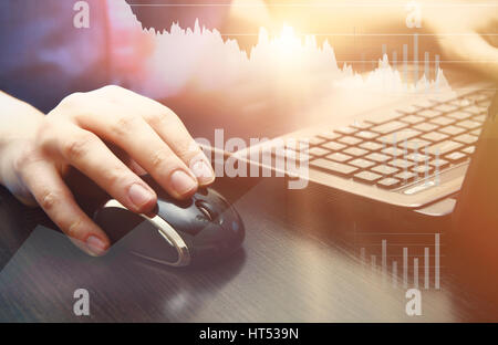 Man using laptop at workplace. mouse computer hand laptop working abstract chart design concept Stock Photo
