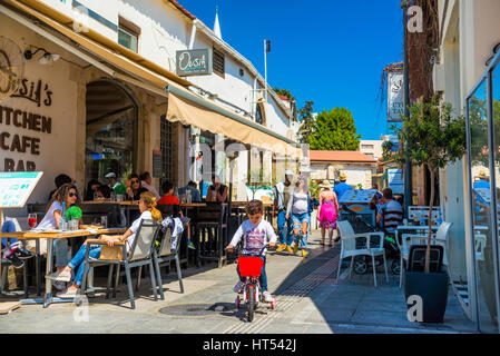 LIMASSOL, CYPRUS - April 01, 2016: Tourists and locals enjoying a summer in cafes at Castle Square. Stock Photo