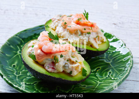Seafood filled avocado with shrimps tapas pinchos from Spain food recipes Stock Photo