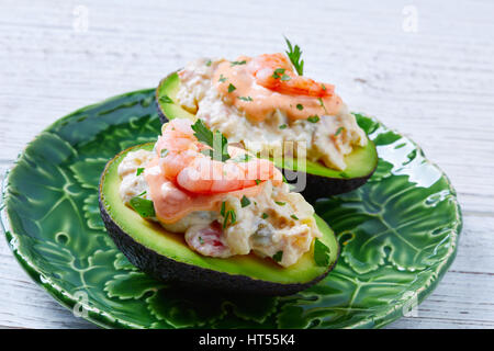 Seafood filled avocado with shrimps tapas pinchos from Spain food recipes Stock Photo