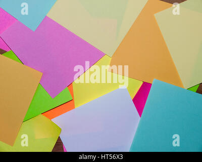 A close up image of a pile of Post It notes in various colours Stock Photo