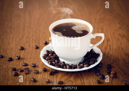 Black hot coffee with raw beans Stock Photo