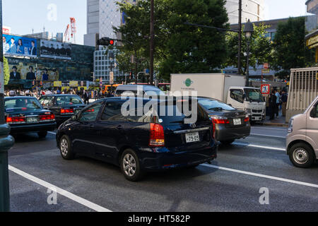 Tokyo, Japan - October 24: Taxi car at Shibuya Crossing on October 24 in Tokyo, Japan, 2016 . Shibuya Crossing is one of the busiest crosswalks in the Stock Photo