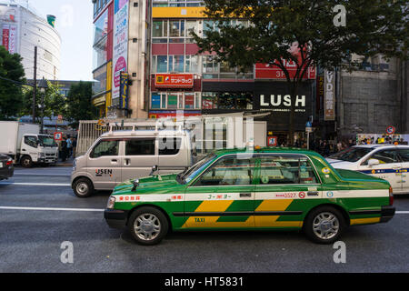 Tokyo, Japan - October 24: Taxi car at Shibuya Crossing on October 24 in Tokyo, Japan, 2016 . Shibuya Crossing is one of the busiest crosswalks in the Stock Photo