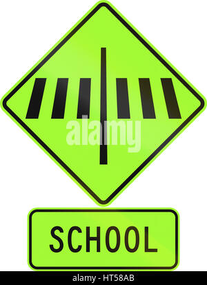 Road sign assembly in New Zealand - Zebra crossing at school, fluorescent version. Stock Photo