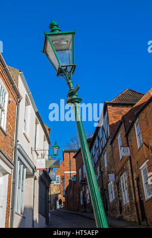 LINCOLN, UK - FEBRUARY 28TH 2017: The famous leaning lamp post situated on the historic Steep Hill in the city of Lincoln, UK on 28th February 2017. Stock Photo