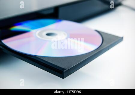 Disc insterted to DVD or CD player Stock Photo