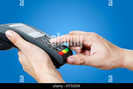 Hand with credit card swipe through terminal for sale Stock Photo