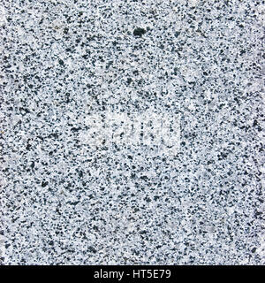 Rough cut granite stone texture, natural grey background, coarse spotted gray plate macro closeup Stock Photo