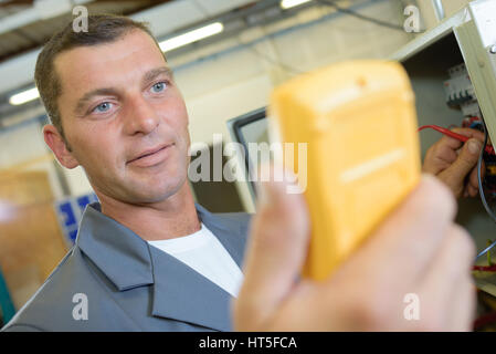 panel check using a voltmeter Stock Photo