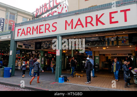 Neon signs and people entering the Pike Place Public Market, Seattle, Washington state, USA Stock Photo
