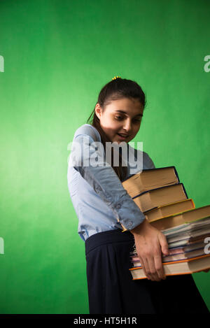 Teen girl with stack of homework, portrait Stock Photo - Alamy