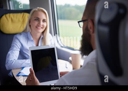 Using modern technology at the train Stock Photo