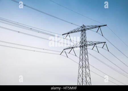 Transmission power tower, electricity pylon. Steel lattice tower, used to support an overhead power line Stock Photo