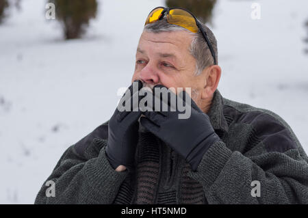 Outdoor portrait of senior man looking with amazement Stock Photo
