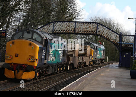 Class 37 diesel electric locomotives, 37218 and 37609, at Arnside with a nuclear flask train. Stock Photo