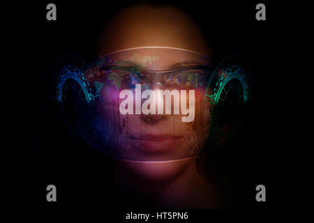 Close-up portrait of young and beautiful woman with the virtual futuristic glasses ( technology concept).Virtual holographic interface and young woman Stock Photo