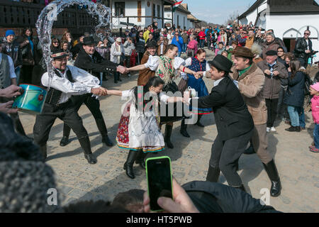 The Hungarian Easter Monday tradition of throwing water at girls Stock Photo