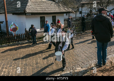 The Hungarian Easter Monday tradition of throwing water at girls Stock Photo